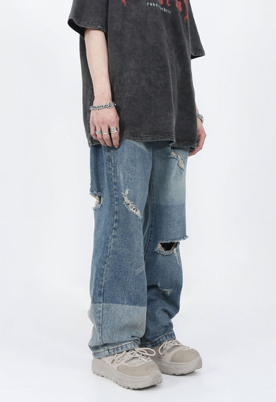 DISTRESSED PATCHED JEANS