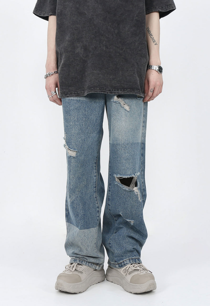 DISTRESSED PATCHED JEANS