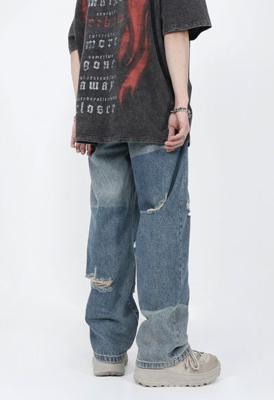 DISTRESSED PATCHED JEANS