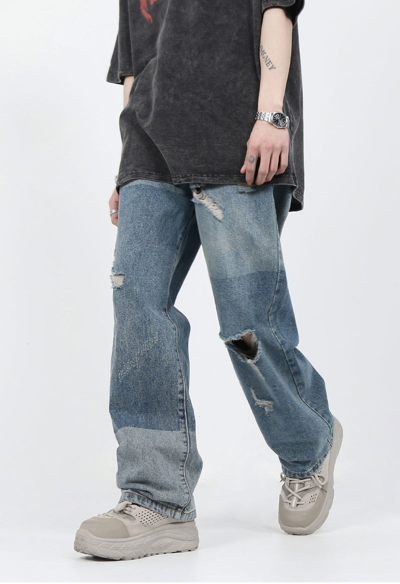 DISTRESSED PATCHED JEANS